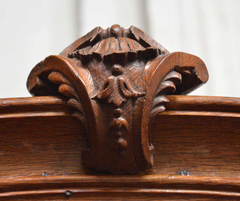 Louis XIVth display cabinet — The symmetrical shell sculpted in oak crowning the top