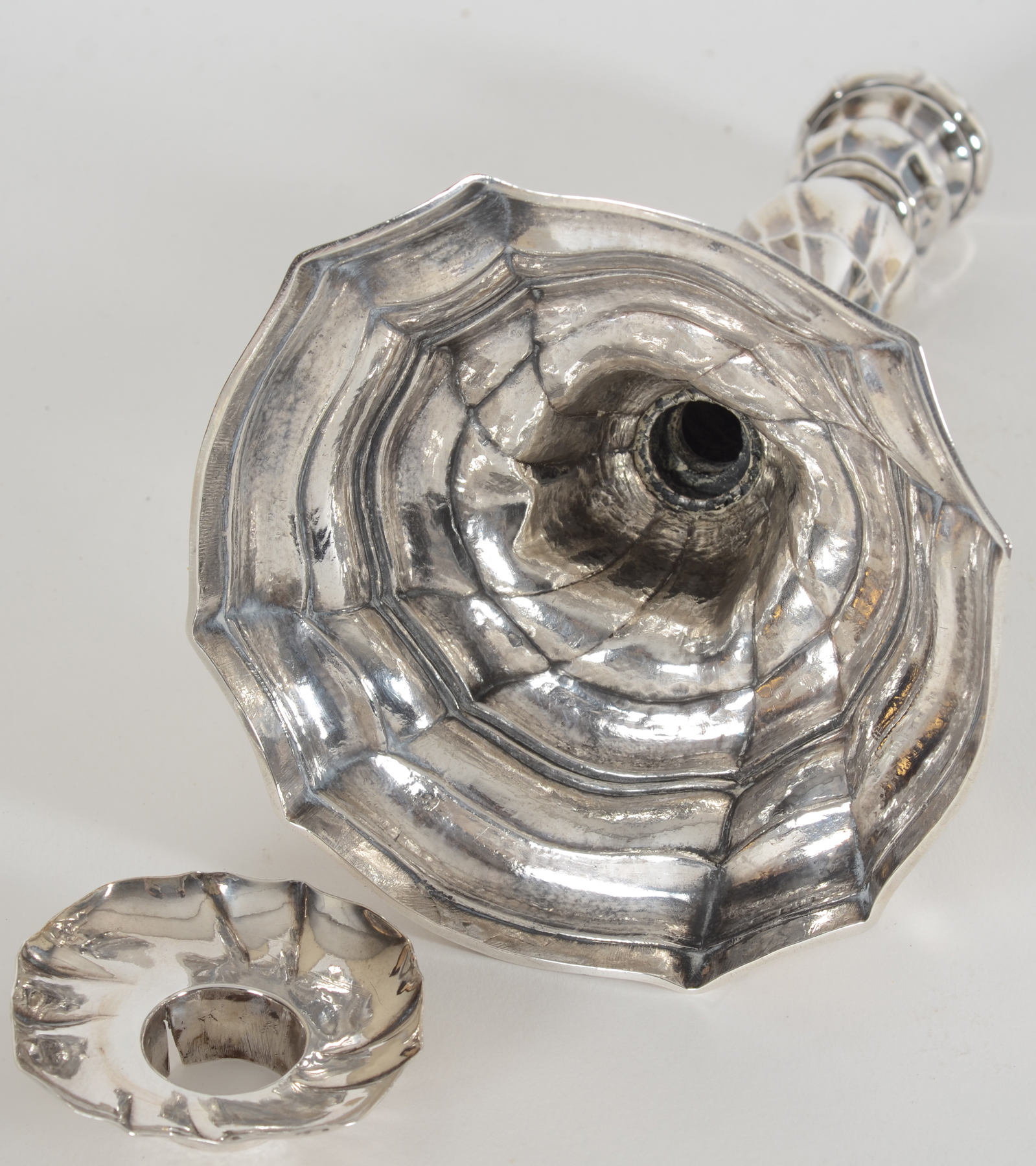 Philippus I. De Clercq, a slender handcrafted L XV 18th century silver candlestick, Ghent, 1777 — <p>Inside of the base</p>