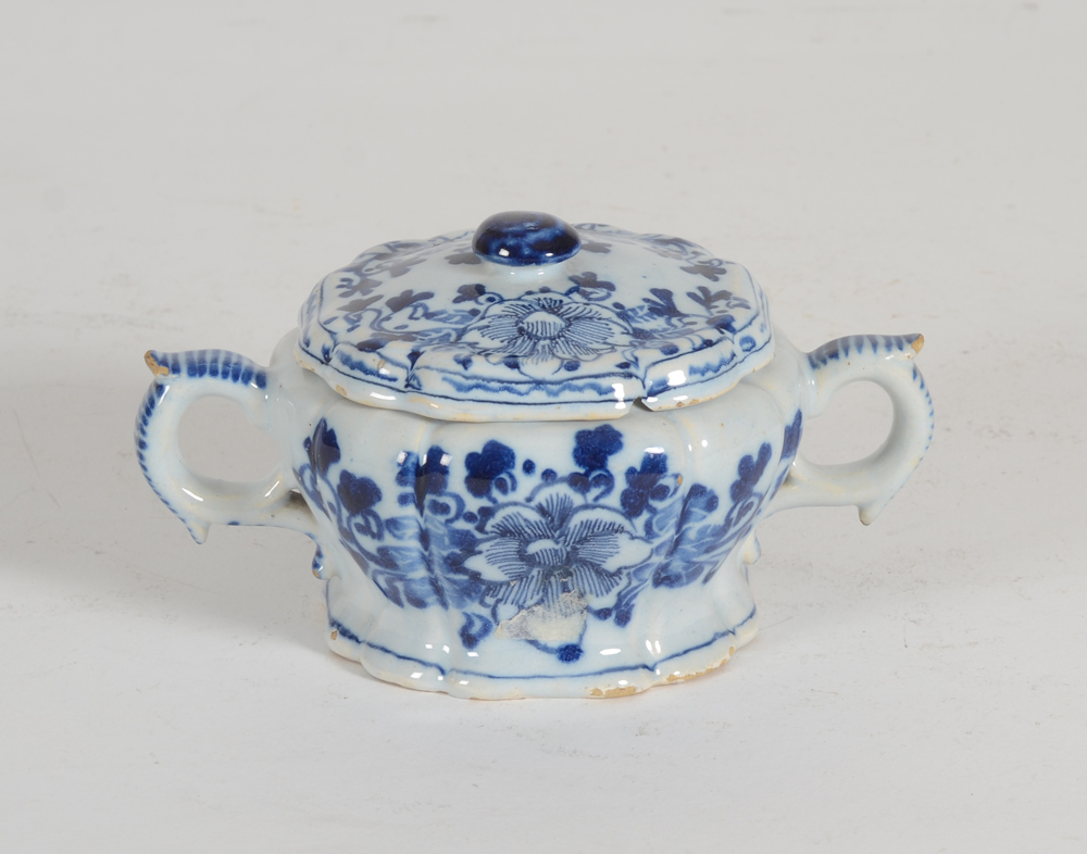 small lobed Delft lidded pot — with aChinese style blue and white flower pattern on both sides and on the lid