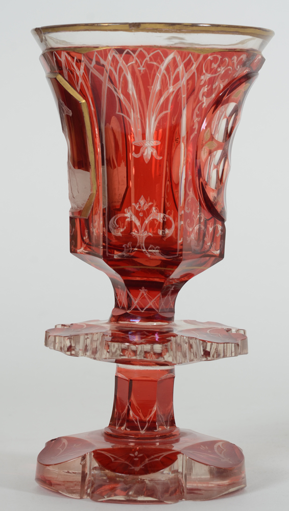 A Bohemian ruby red overlay glass beaker with standing horse, 19th century — The side with gothic revival decorations