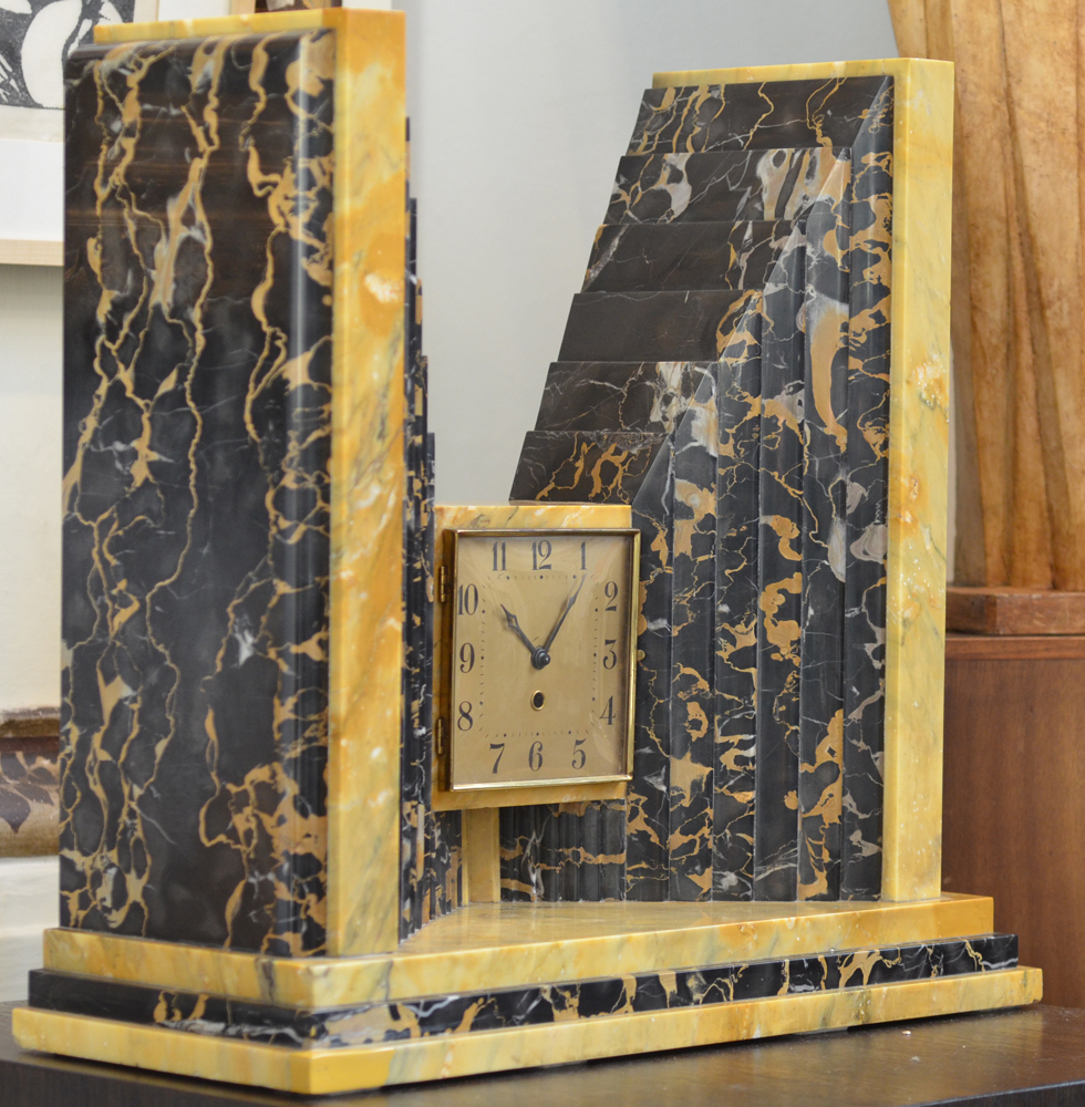 An impressive portor and yellow Sienna marble mantle clock, 1930s — side view