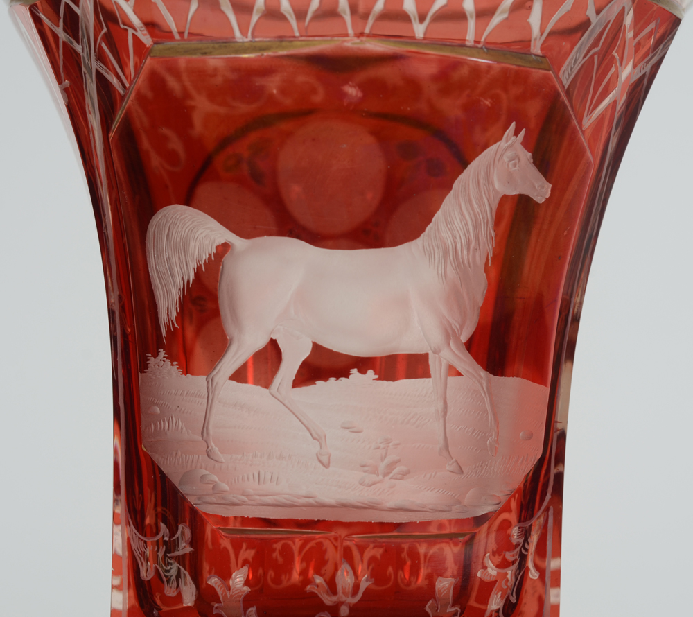 A Bohemian ruby red overlay glass beaker with standing horse, 19th century — Detail of the fine engraving of the horse on the front