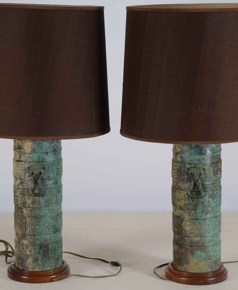 A pair of probably 1980's table lamps in Chinese Archaic bronze style — the darker patinated side