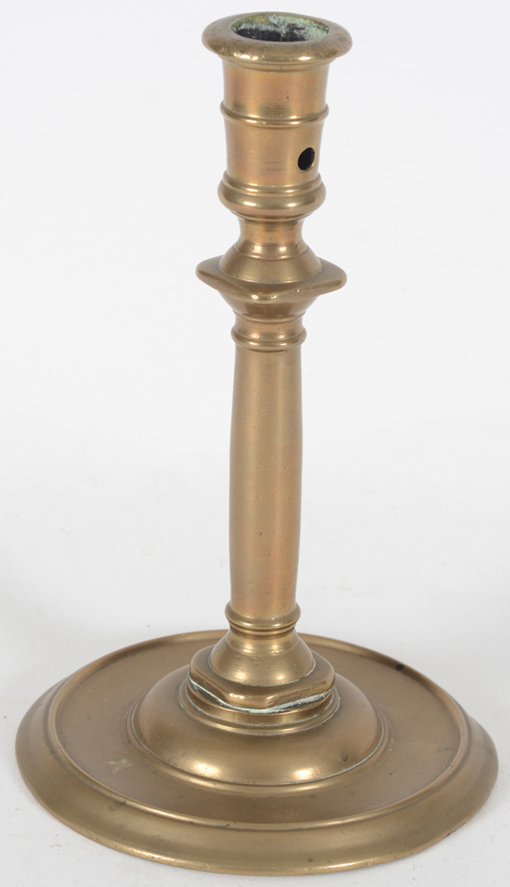 A good 16th century Henri II brass candlestick 'à la Romaine — Side view showing the circular aperture in the socket