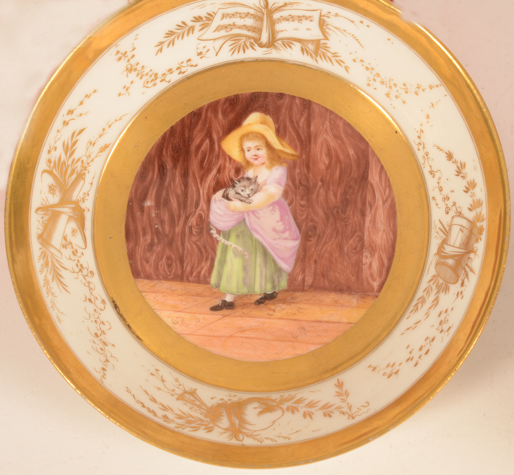 Allegorical porcelain cup and saucer — Detail of the painting on the saucer, of a girl holding a cat