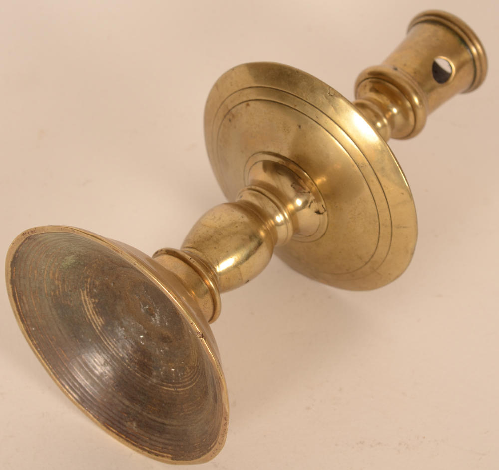 A brass Flemish renaissance candlestick — The candlestick laying down