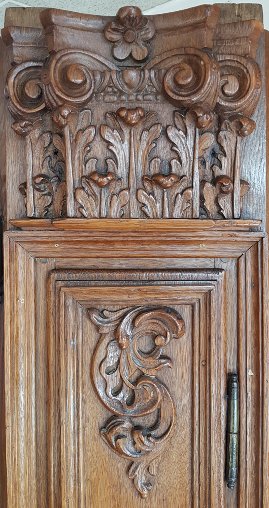Flemish regence armoire — Detail of the one of the capitals at the side