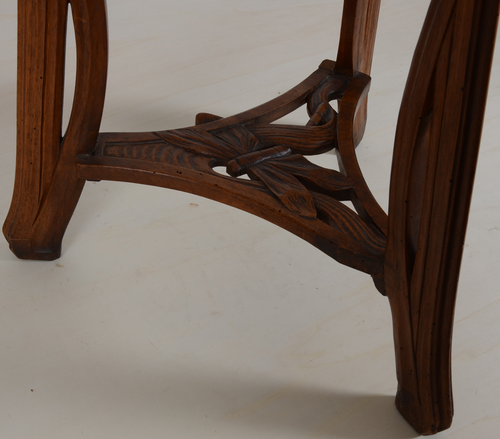 A French art nouveau walnut pedestal 'water lilies and dragonflies' — Detail of the base with a large sculpted dragonfly