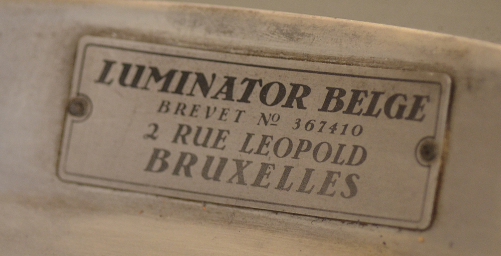 Monumental bronze uplighter — detail of the label at the inside