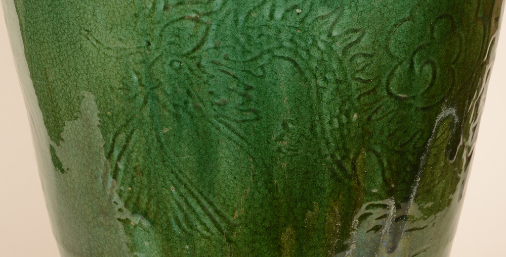 A green glazed large martavan — detail of the inscised dragon decoration