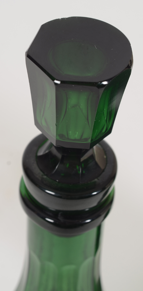 Two early emerald green cut glass decanter bottles, probably England, 19th century — Detail of one of the stoppers