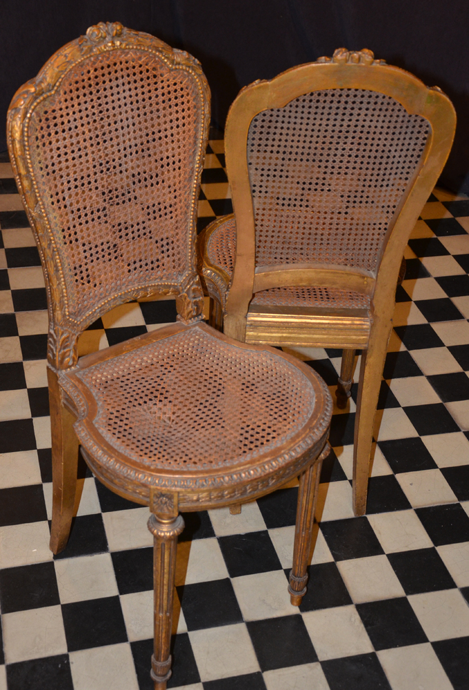 A pair of Napoleon III style carved gilt wood chairs — Front and back of the chairs