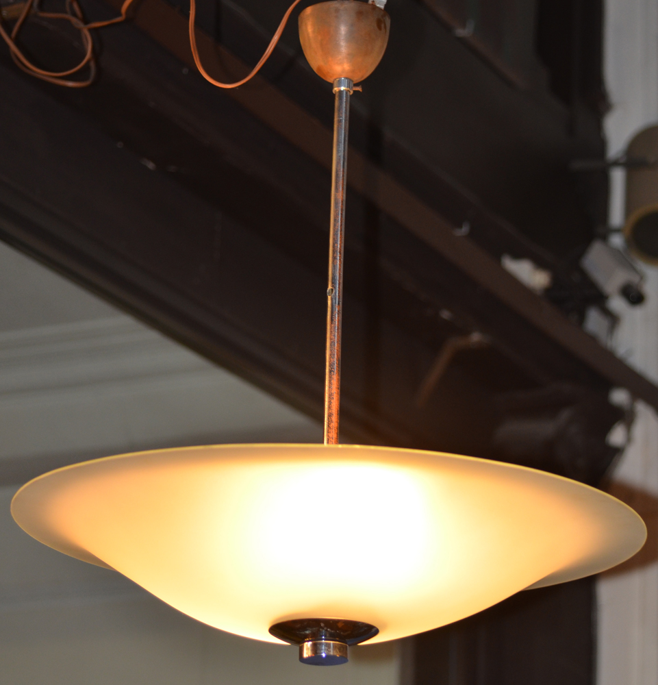 A large modernist ceiling light — the lamp during daytime