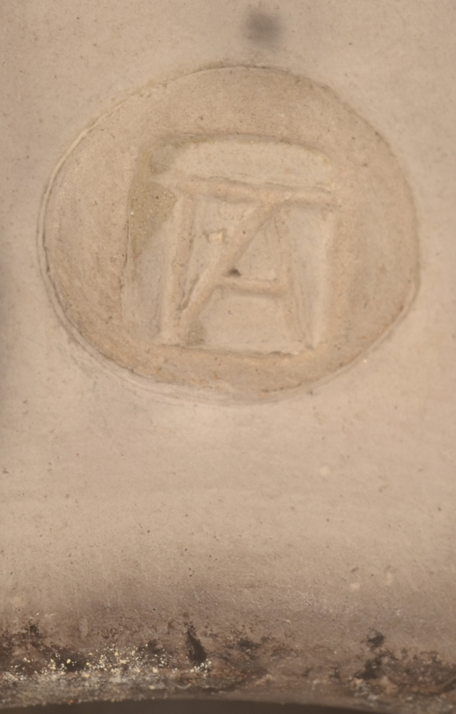 Potter TA — Monogram mark near the base of the vase
