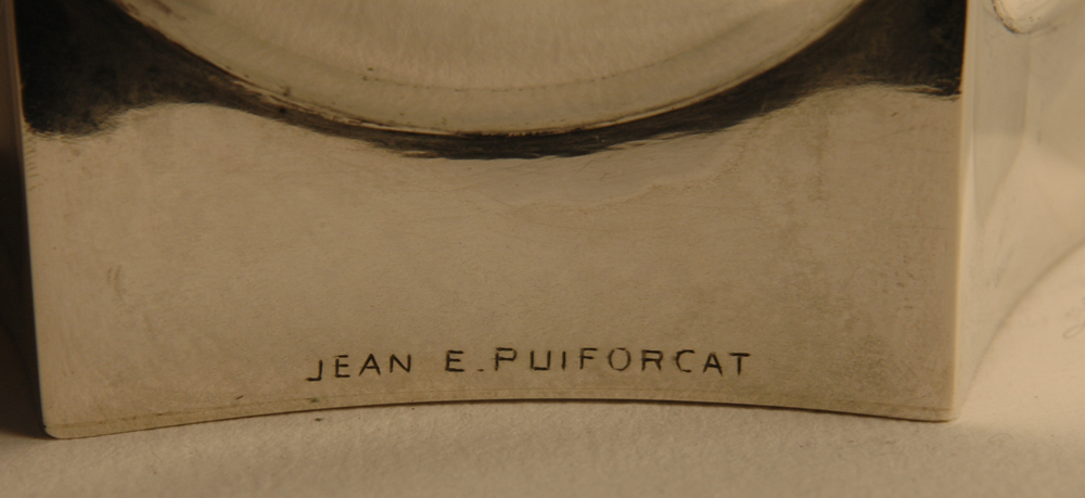 Jean E. Puiforcat — Signature of the artist near the base of the vase.