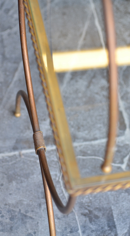 A nest of three occasional tables — Detail of the side