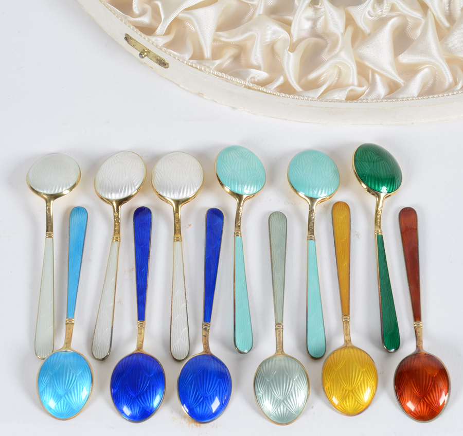 Finnish tea spoon set — An associated set of 12 enamel and silver gilt tea spoons in the original presentation box.
