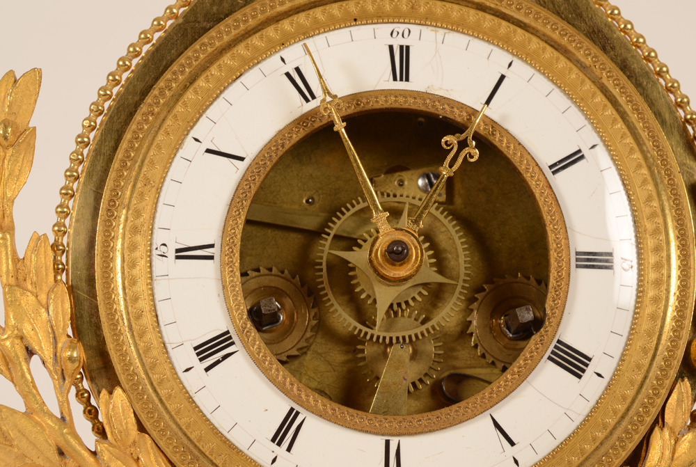 Skeleton Clock — Detail of the dial.