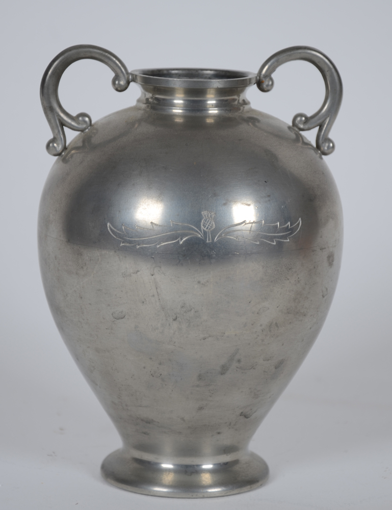 Svenskt Tenn — A two handled vase, in pewter, with an engraved flower motif.