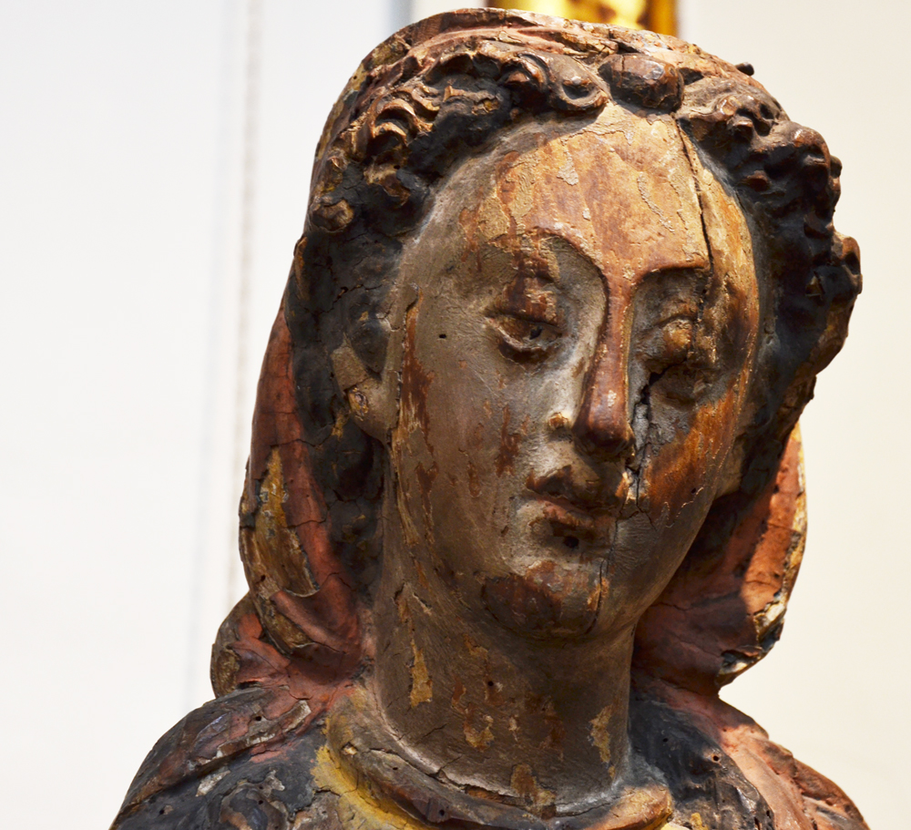 A large polychromed oak baroque sculpture of a female saint — Detail of the face