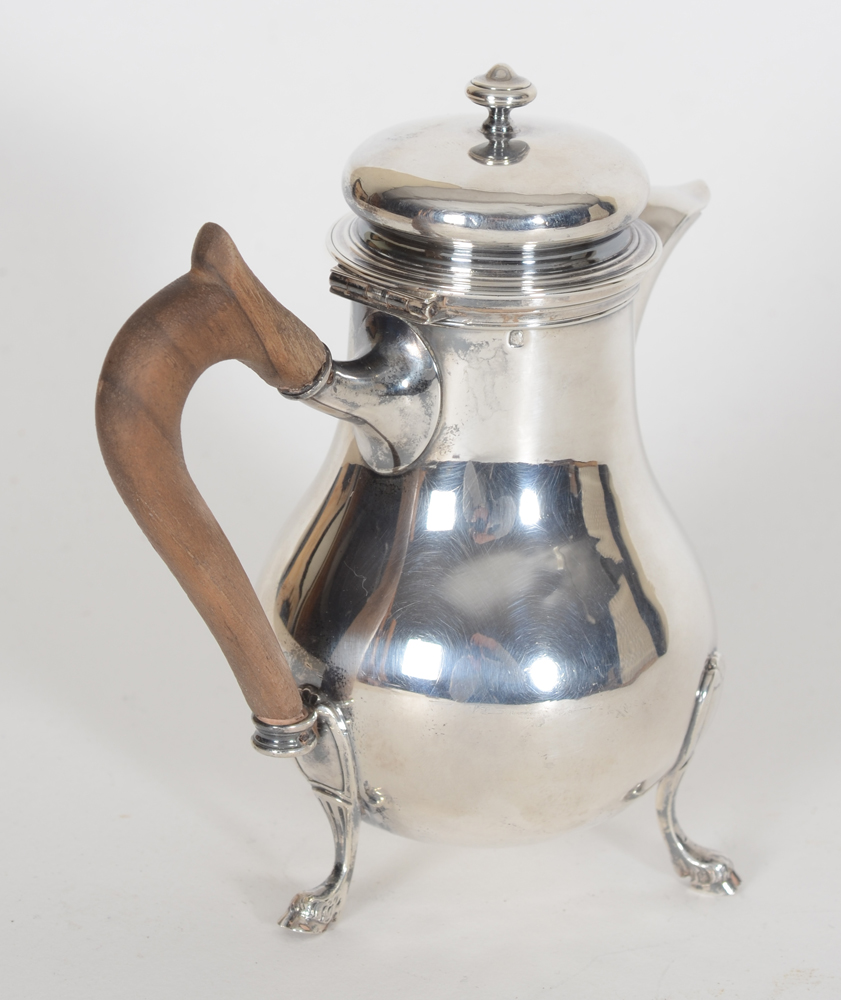Fray et Fils (Paris), a small, almost miniature silver and wood coffepot, end of the 19th century — side view and view of the wooden handle