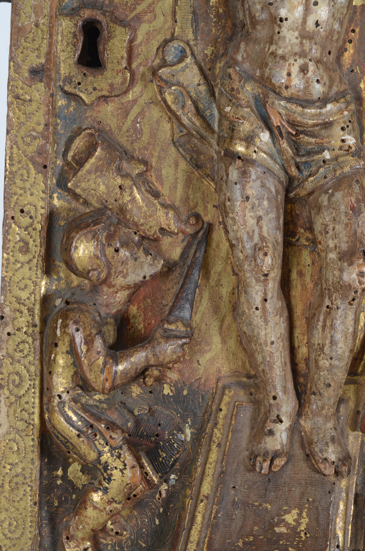 An antique tabernacle door in polychromed wood, possibly Southern Europe — <p>Detail of teh Roman soldier on the left, with antropomorphic shield</p>