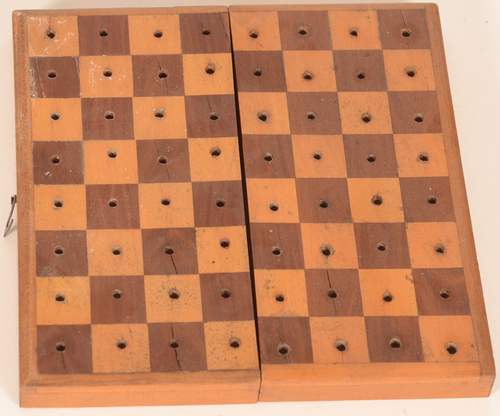 Travel chess set — the board with traces of use and age