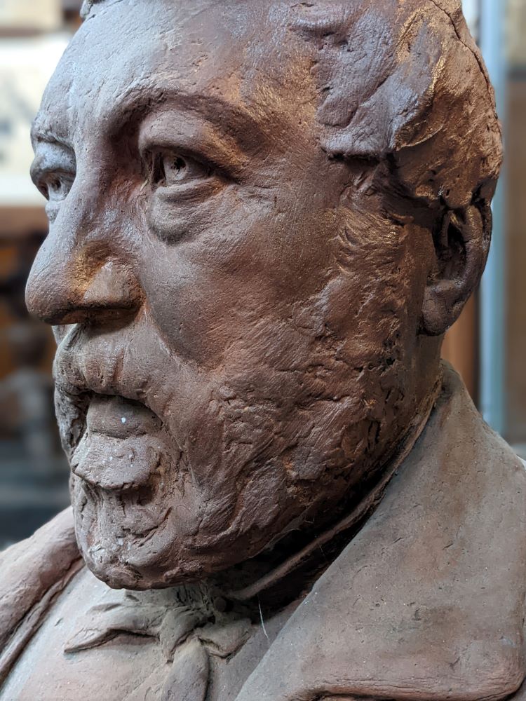 Georges Van der Straeten terracotta bust — profile in grazing light