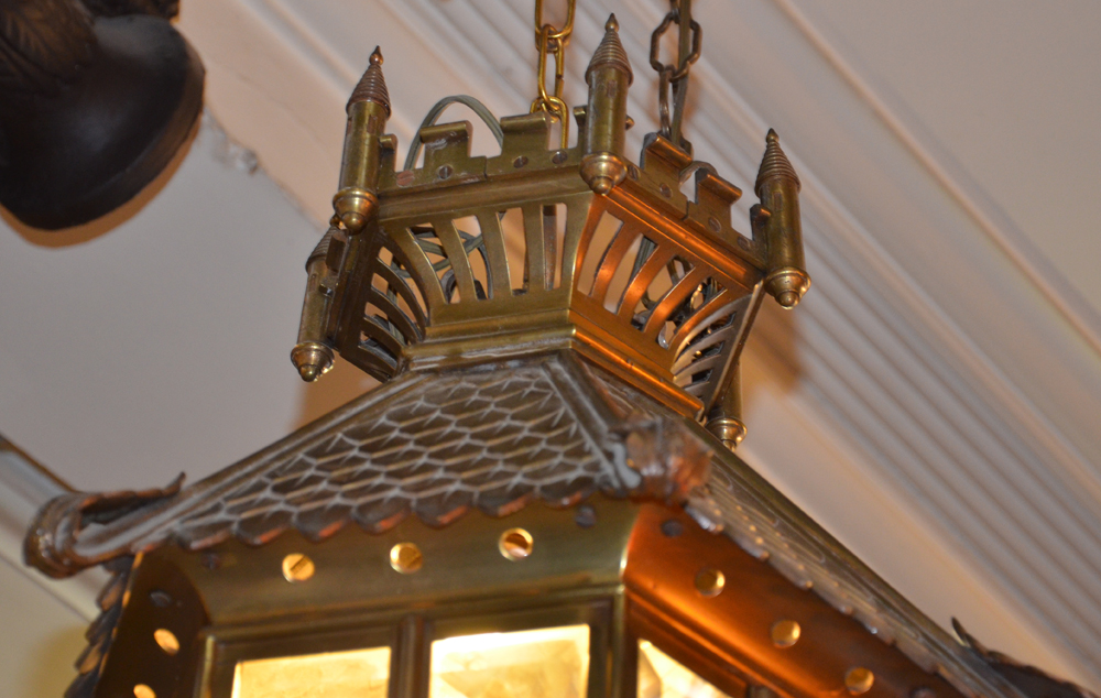 An impressive bronze hall lantern ca. 1920 — Detail of the crown shaped top, with gothic revival inspiration