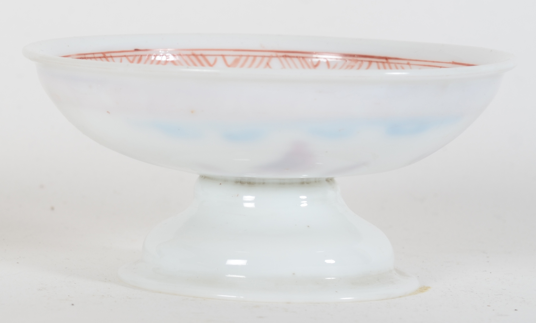 A probably 18th Century white glass (opaline) tazza, painted with flowers and doves — <p>profile view from the side</p>