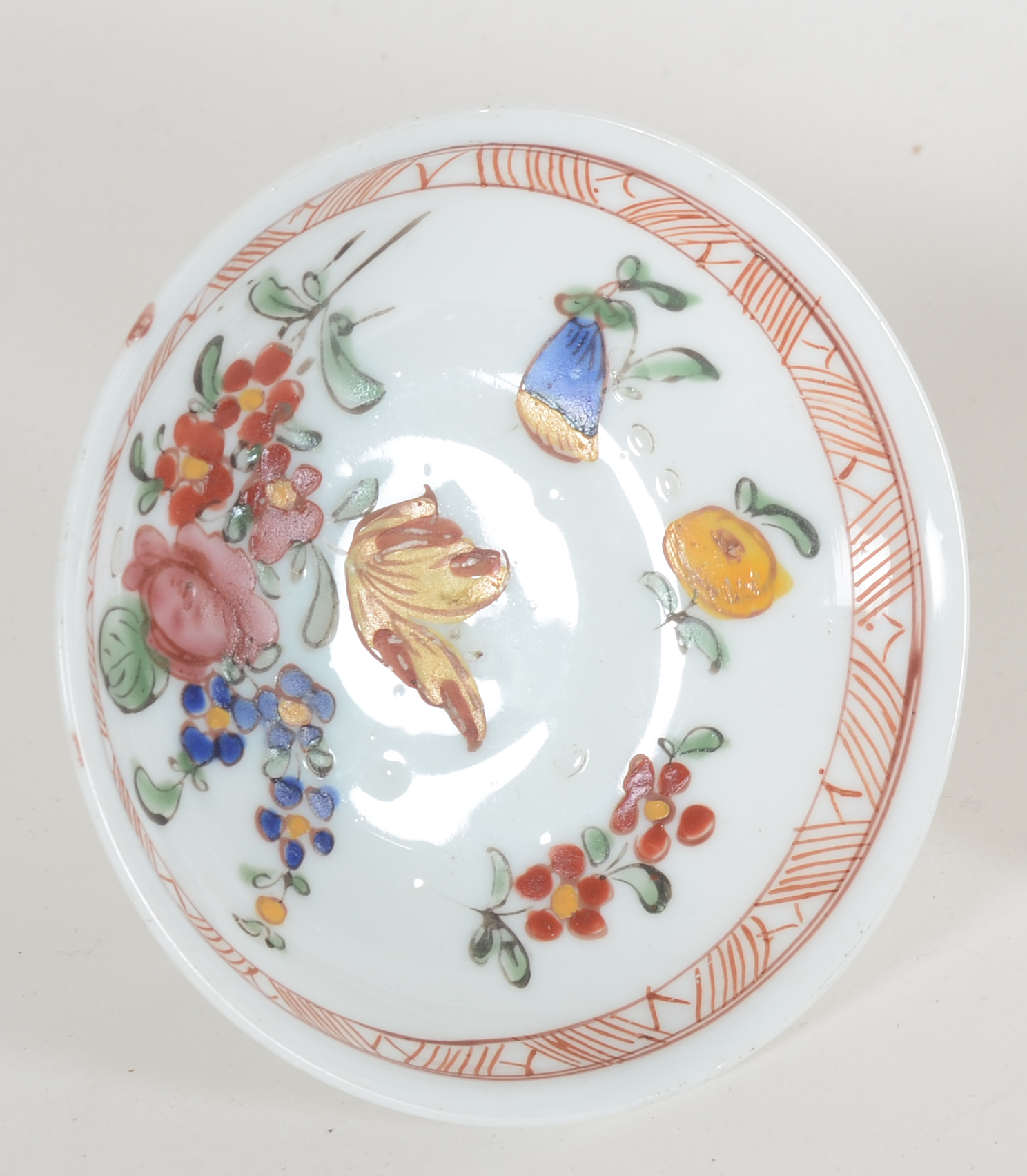 A probably 18th Century white glass (opaline) tazza, painted with flowers — <p>View of the inside with the painted decoration in Chinese style</p>