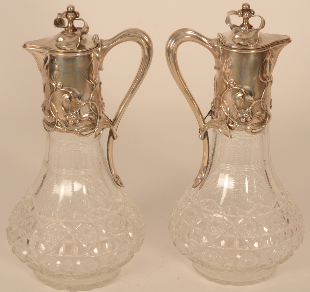 Wilkens a pair of art nouveau silver and cut crystal carafes — the carafes with elegant silver handles