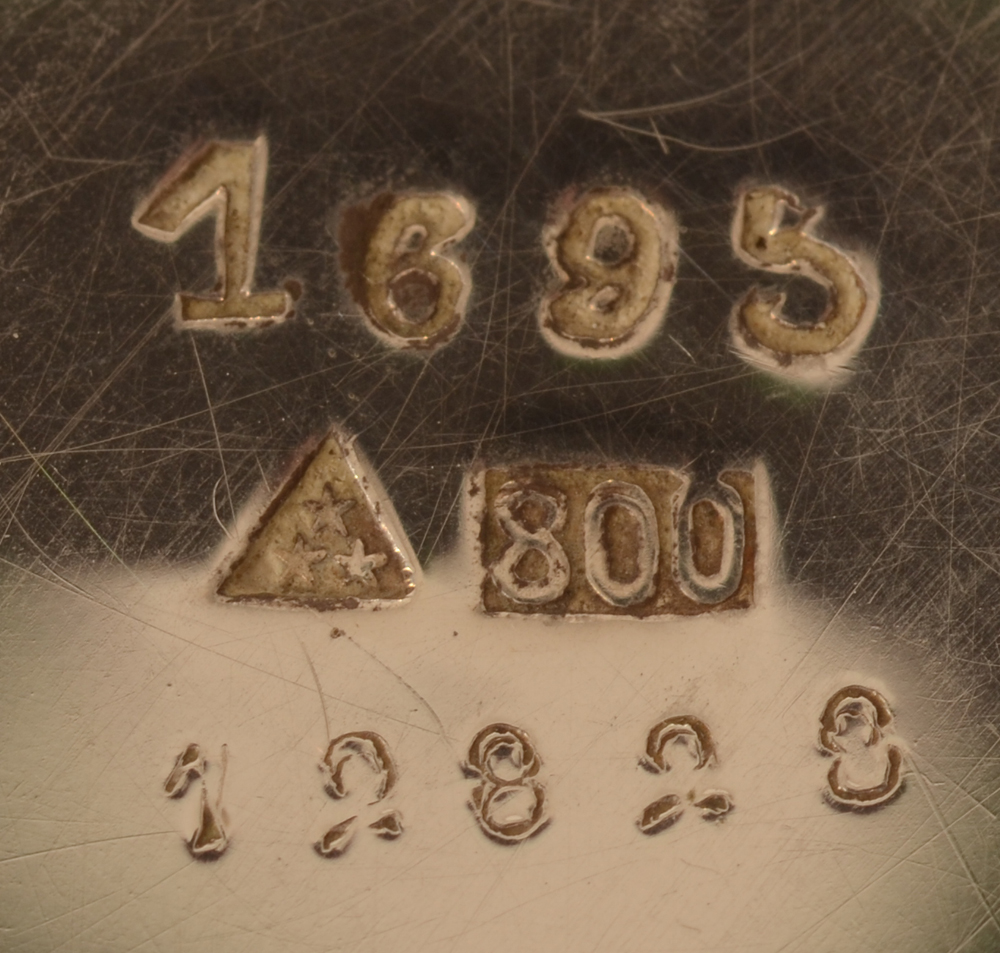 Wolfers Frères — Marks on the bottom of one of the items with model number, makers mark and alloy mark