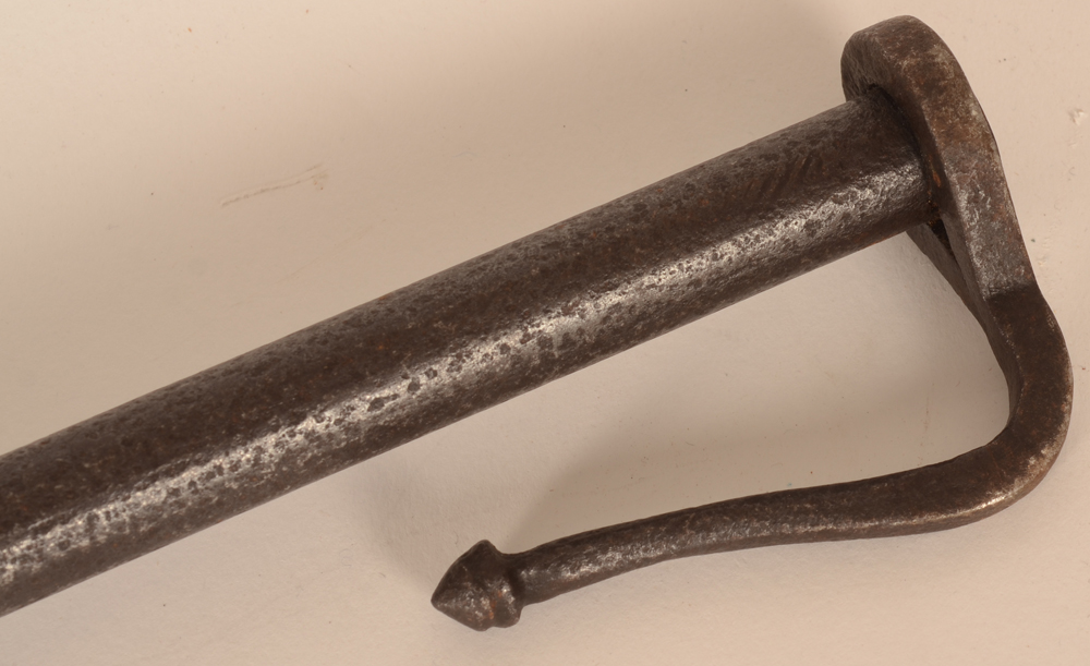 wrought iron blowpipe — Top of the pipe with decorated clip