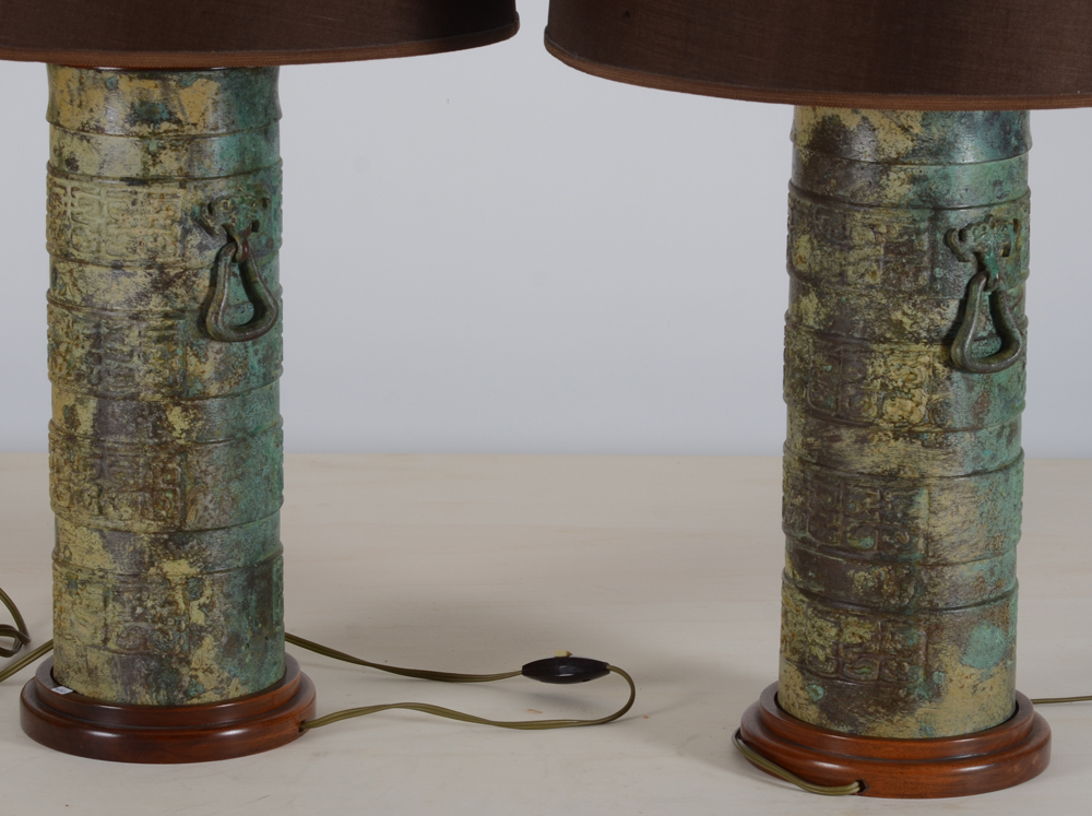 A pair of probably 1980's table lamps in Chinese Archaic bronze style — the lighter patinated side