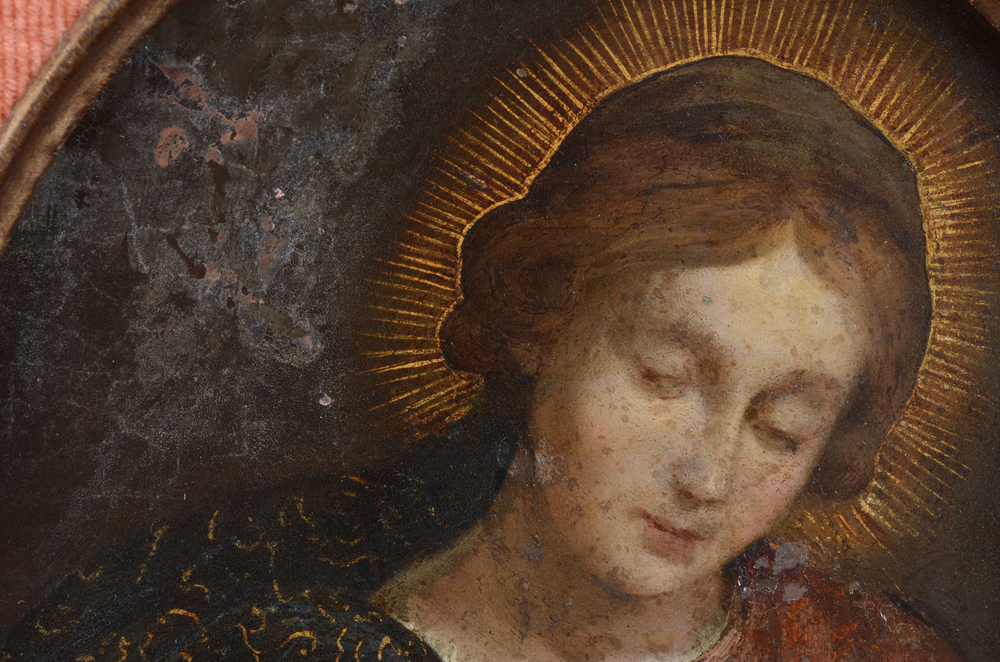 Madonna and child Flemish old master painting on copper — Detail of the delicate rendering of the face of the Madonna and also showing an old repainted surface to the right of the face