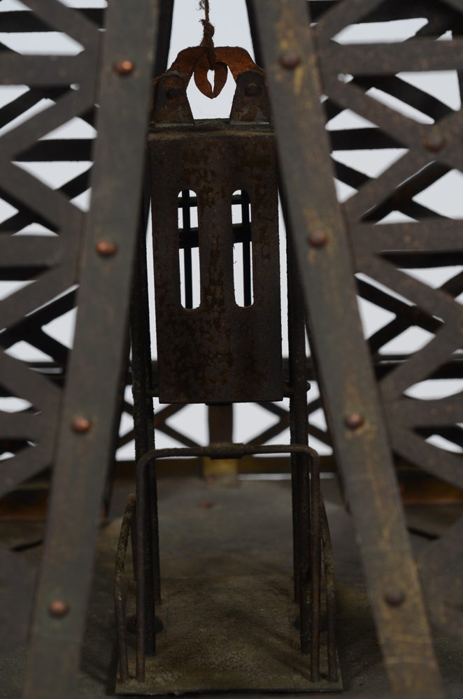 A vintage riveted copper maquette of the Eiffel Tower — Detail of the elevator inside