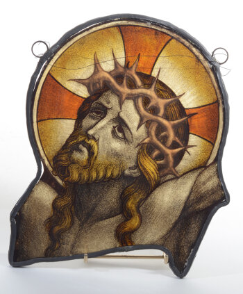 A stained glass fragment depicting Christ on the cross, 19th century
