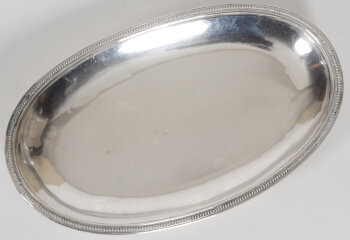 An oval handmade perlé silver dish, France, 19th century