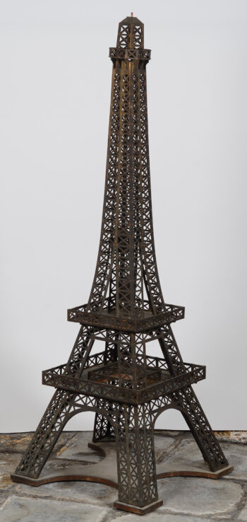 A vintage riveted copper maquette of the Eiffel Tower