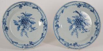 A pair of Delftware dishes with grape decoration, possibly 18th or early 19th century