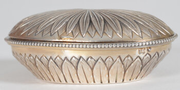 An oval silver and silver gilt box in the L XVIth style