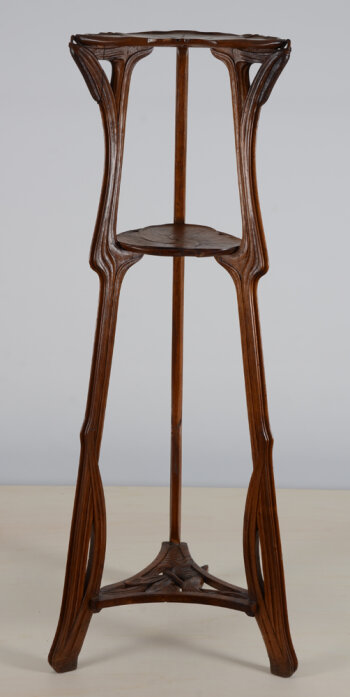 A French art nouveau walnut pedestal 'water lilies and dragonflies'