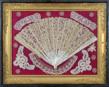 A Victorian lace and mother-of-pearl fan and some lace samples in a rectangular frame