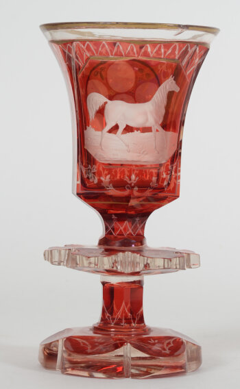 A Bohemian ruby red overlay glass beaker with standing horse, 19th century