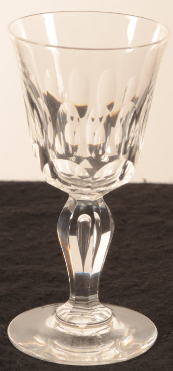Set of cut crystal glasses on baluster stem