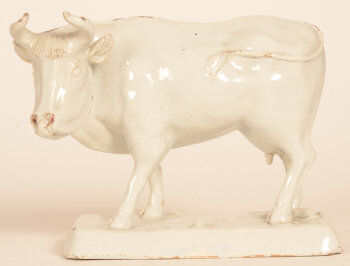 A white glazed ceramic Delft cow probably 18th century