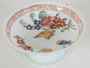 A probably 18th Century white glass (opaline) tazza, painted with flowers